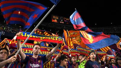 Fans show their support during the match. Getty Images
