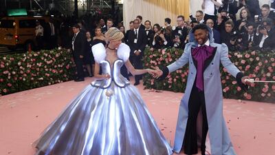 While the world was going crazy for Zendaya's light up Cinderella gown, somehow everyone overlooked that Law Roach wore a lavender hooded coat, with magenta cravat. EPA