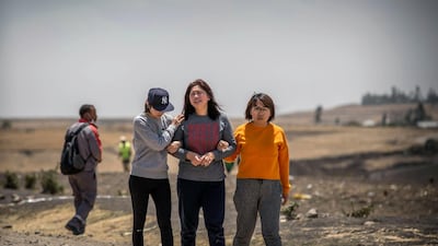 Family members cry at the scene where the Ethiopian Airlines Boeing 737 Max 8 crashed shortly after takeoff on Sunday. AP