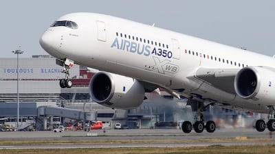 An Airbus A350 takes off at the aircraft builder's headquarters in Colomiers near Toulouse, France. The company won approval from its board for a new 15 billion euros (Dh59.1bn) credit facility. Reuters