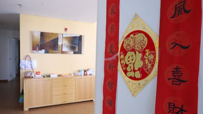 Traditional Chinese decorations give the apartment a homely feel. Chris Whiteoak / The National