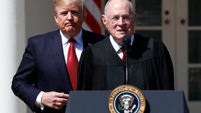 US President Donald Trump and Supreme Court Justice Anthony Kennedy at the swearing in of Justice Neil Gorsuch at the White House on April 10, 2017. Carolyn Kaster / AP Photo