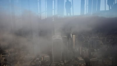 The public enjoying the view is reflected in the windows of the Shard as the city below is shrouded in fog on December 1, 2016, in London, England. Much of the country has been experiencing sub-zero temperatures. Dan Kitwood / Getty Images