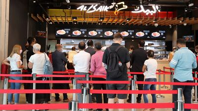 Al Baik at Expo 2020 serves its signature fried chicken nuggets as well as shrimp, jumbo shrimp and falafel. Pawan Singh / The National