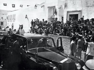Sheikh Zayed waves to crowds greeting him on a visit. Courtesy National Archives