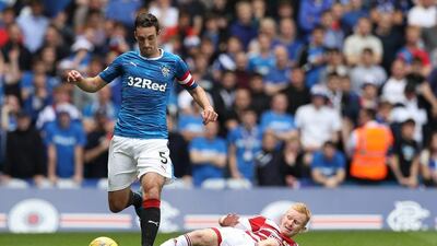 Lee Wallace of Rangers jumps over the tackle of Alister Crawford of Hamilton Academical during the Scottish Premiership match between Rangers and Hamilton Academical at Ibrox Stadium on August 6, 2016 in Glasgow, Scotland. Lynne Cameron / Getty Images