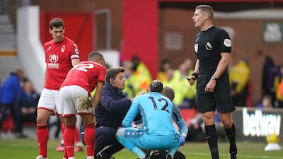 Nottingham Forest goalkeeper Keylor Navas receives medical attention. PA