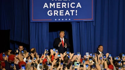 President Donald Trump walks onto the stage during a "Keep America Great" campaign rally at BancorpSouth Arena on November 1, 2019 in Tupelo, Mississippi. AFP