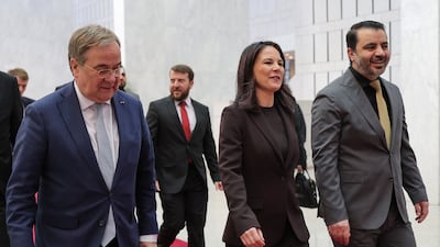 Syria's interim Foreign Minister Asaad Al Shibani receives German Foreign Minister Annalena Baerbock in Damascus on Thursday during a visit to reopen the German embassy. Sana / AFP