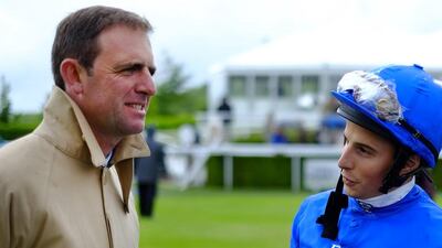 Charlie Appleby chats with jockey William Buick at Goodwood Racecourse on May 22, 2014 in Chichester, England. Alan Crowhurst / Getty Images