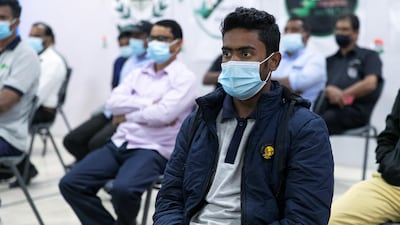 Workers at Delhi Private School in Dubai listen to V. Muraleedharan, Indian Minister of State for External Affairs give details about a programme that has been launched to help blue-collar staff learn soft skills and language. Reem Mohammed / The National