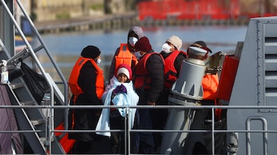 Migrants disembark in Dover, south-east England, after being rescued in the Channel. Reuters