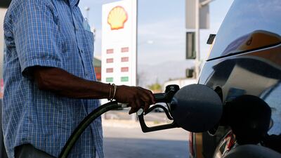 A man refuels his car at a Shell gas station in Los Angeles, California. EPA