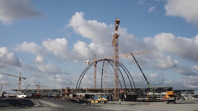 Airport employees are seen working on the mosque being built in front of the main terminal. Getty Images