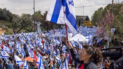 Israeli flags being waved outside the parliament in Jerusalem. Bloomberg