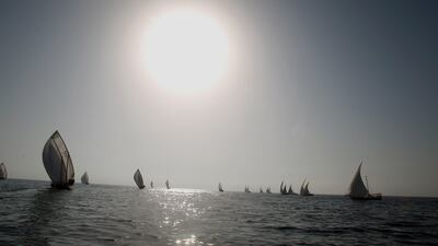 Emirati competitors sail in the Gulf during the Al-Gaffal 60 ft traditional dhow sailing race between the island of Sir Bu Nair, near the Iranian coast, and the Gulf emirate of Dubai on May 29, 2010. AFP PHOTO/KARIM SAHIB *** Local Caption *** 637220-01-08.jpg