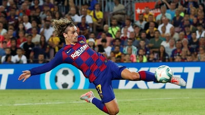 Barcelona's Antoine Griezmann stretches to equalise against Betis. Reuters