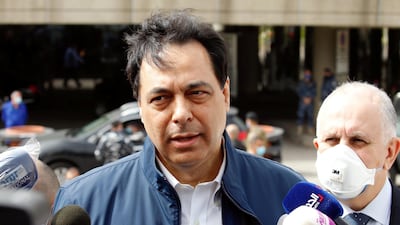 Lebanese Prime Minister Hassan Diab speaks to reporters outside Beirut's international airport on April 5, 2020 after it was shut down due to the coronavirus pandemic. Reuters