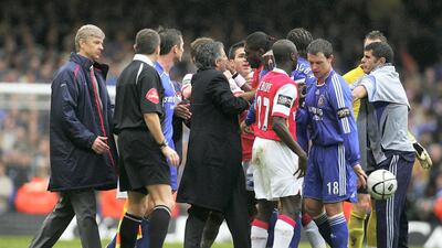 Wenger (left) and Chelsea manager Jose Mourinho come on to the pitch to try and calm the players down during the League Cup final in 2007, which Chelsea won. Alex Livesey / Getty Images