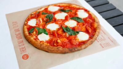 Diners can choose from signature pizzas or build their own. The Red Vine has mozzarella, cherry tomatoes, Parmesan, basil, classic red sauce and a drizzle of extra virgin olive oil. Photo: Blaze Pizza