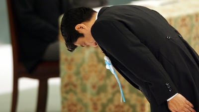 This file photo taken on August 15, 2007 shows Japanese Prime Minister Shinzo Abe (R) bowing at the alter as Emperor Akihito (L) and Empress Michiko (C) look on during a memorial ceremony for the national war dead to commemorate the end of World War II. AFP