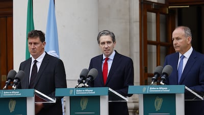 Irish Taoiseach Simon Harris, centre, Foreign Minister Micheal Marti, right, and Environment Minister Eamon Ryan announce that the Republic of Ireland has recognised the state of Palestine. EPA