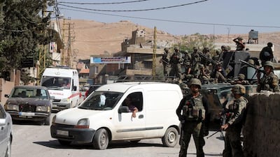 Lebanese troops patrol the town of Arsal on August 9, 2014, following a week of clashes with Islamist rebels from Syria. EPA