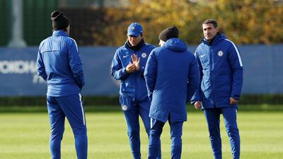 Chelsea manager Antonio Conte, centre, talks to his coaches during training. John Sibley / Reuters