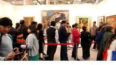 Art enthusiasts queue to view the works of M F Husain in a gallery in New Delhi over the weekend.