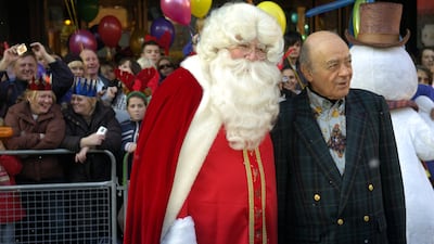 Mr Al-Fayed and Santa Claus at Harrods in 2007. Getty Images