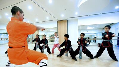 Children take a kung fu class during the Protect Childhood: it’s Precious carnival at Al Jalila Cultural Centre in Dubai. The event was aimed at empowering children and helping them to avoid abuse. Satish Kumar / The National