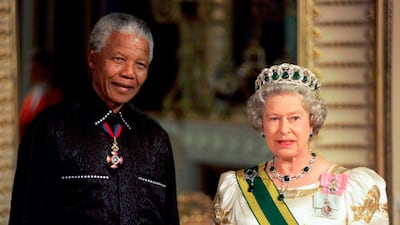 South African leader Nelson Mandela with Queen Elizabeth at Buckingham Palace. AP