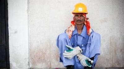Rohul Amin, a labourer, sits on break from work. The deputy regional director of the ILO gave details of a new program it is working on with the UAE, which aims to improve the rights of workers.