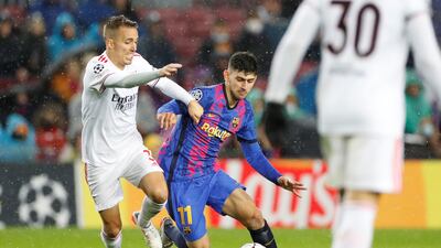 Barcelona's winger Yusuf Demir in action against Benfica's Alex Grimaldo. EPA