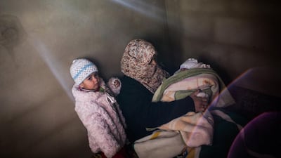 Syrian refugee Dalil, 20, with her one -year-old Rima and 6 week-old baby Fatima, at a rented house in Arsal, Lebanon. A McConnell / UNHCR / December 15, 2013