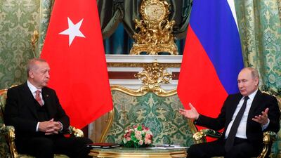 Russian President Vladimir Putin (R) speaks with Turkish President Recep Tayyip Erdogan during their meeting at The Kremlin in Moscow on April 8, 2019. AFP