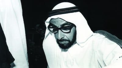 Sheikh Zayed pores over an official document