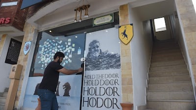 The restaurant was launched in January by four college friends who were surprised to see fans coming in with their families, despite the sometimes very violent and explicit nature of the series. Farooq Naeem / AFP