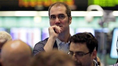 Traders work in the oil options pit at the New York Mercantile Exchange on Thursday, as oil lingered near seven-month lows around $90 a barrel as Europe's debt crisis festers and China's economy continues to slow. AP Photo