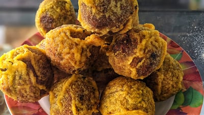 Fried jaggery-coated dal snacks.