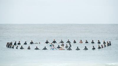 Local surfers participate in a paddle-out wreath laying ceremony for the Christchurch mosque attacks at Manly Beach in Sydney, Australia. Getty Images