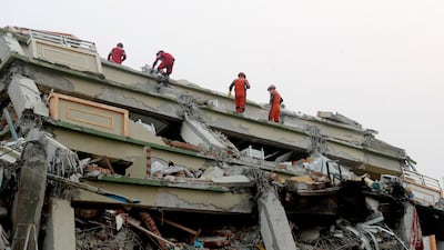 Chinese rescuers search for earthquake victims at the collapsed Sky Villa in Mandalay, Myanmar. EPA