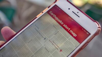 An earthquake warning application on a smartphone in Los Angeles. AP