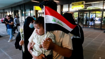 Iraqi and Syrian evacuees arrive at Baghdad International Airport. Reuters
