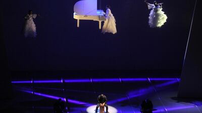 Artists perform on stage during the opening ceremony of the Sheikh Jaber al-Ahmad grand cultural centre in Kuwait City. Kuna / AFP