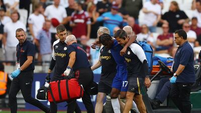 Injured Chelsea goalscorer Carney Chukwuemeka is helped off the pitch. Reuters