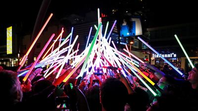 Star Wars enthusiasts huddle with their lightsabers after participating in Earth Hour at Taguig City, Philippines. Reuters