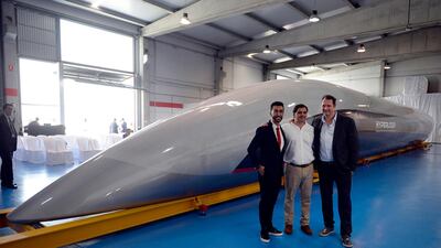 HTT co-founders Bibop Gresta (L) and (R) Dirk Ahlborn with mock-up of the HTT transit pod. AFP