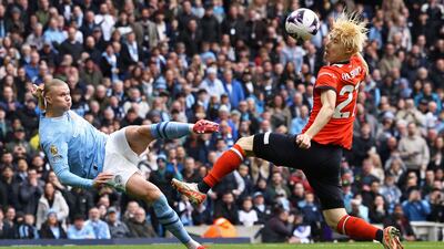 Manchester City striker Erling Haaland's shot is deflected into the net off Luton Town's Daiki Hashioka for the opening goal. AFP