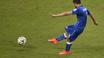 Claudio Marchisio shoots to score Italy's first goal against England on Saturday at the 2014 World Cup. Odd Andersen / AFP